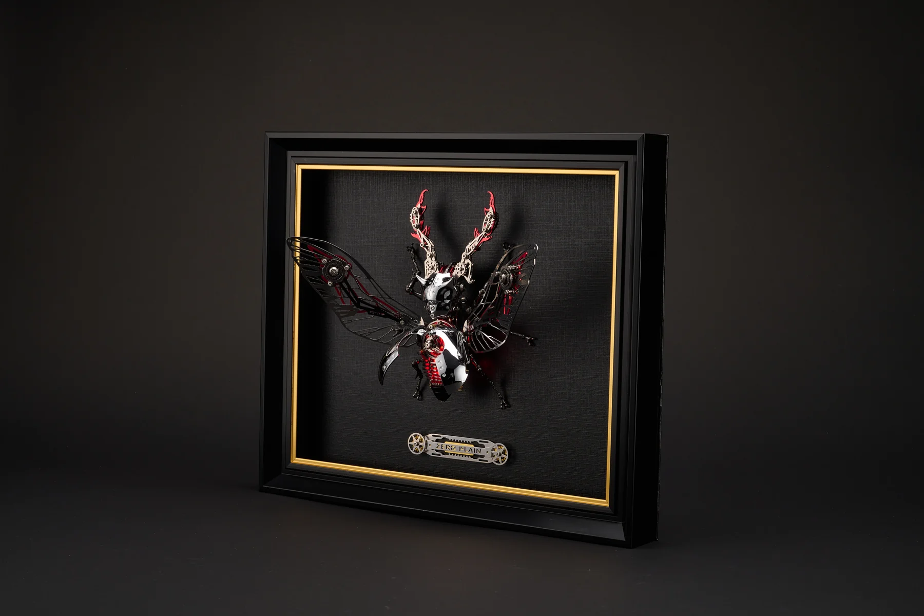 Mechanical Stag Beetle in a dark display frame with gold trim